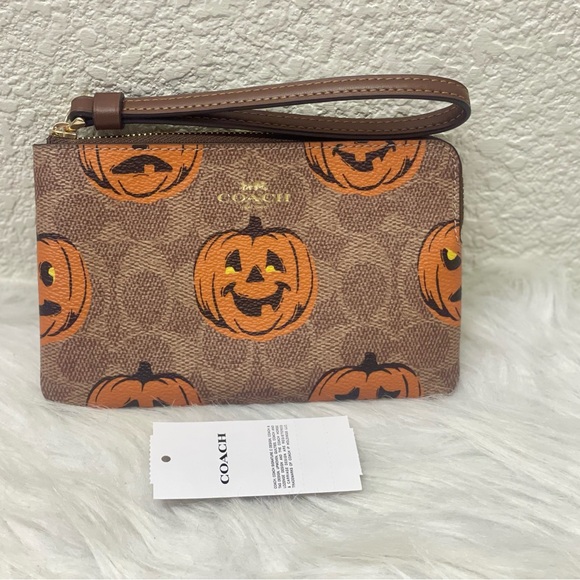 Coach Handbags - NWT Coach Corner Zip Wristlet In Signature Canvas With Halloween Print CCL20